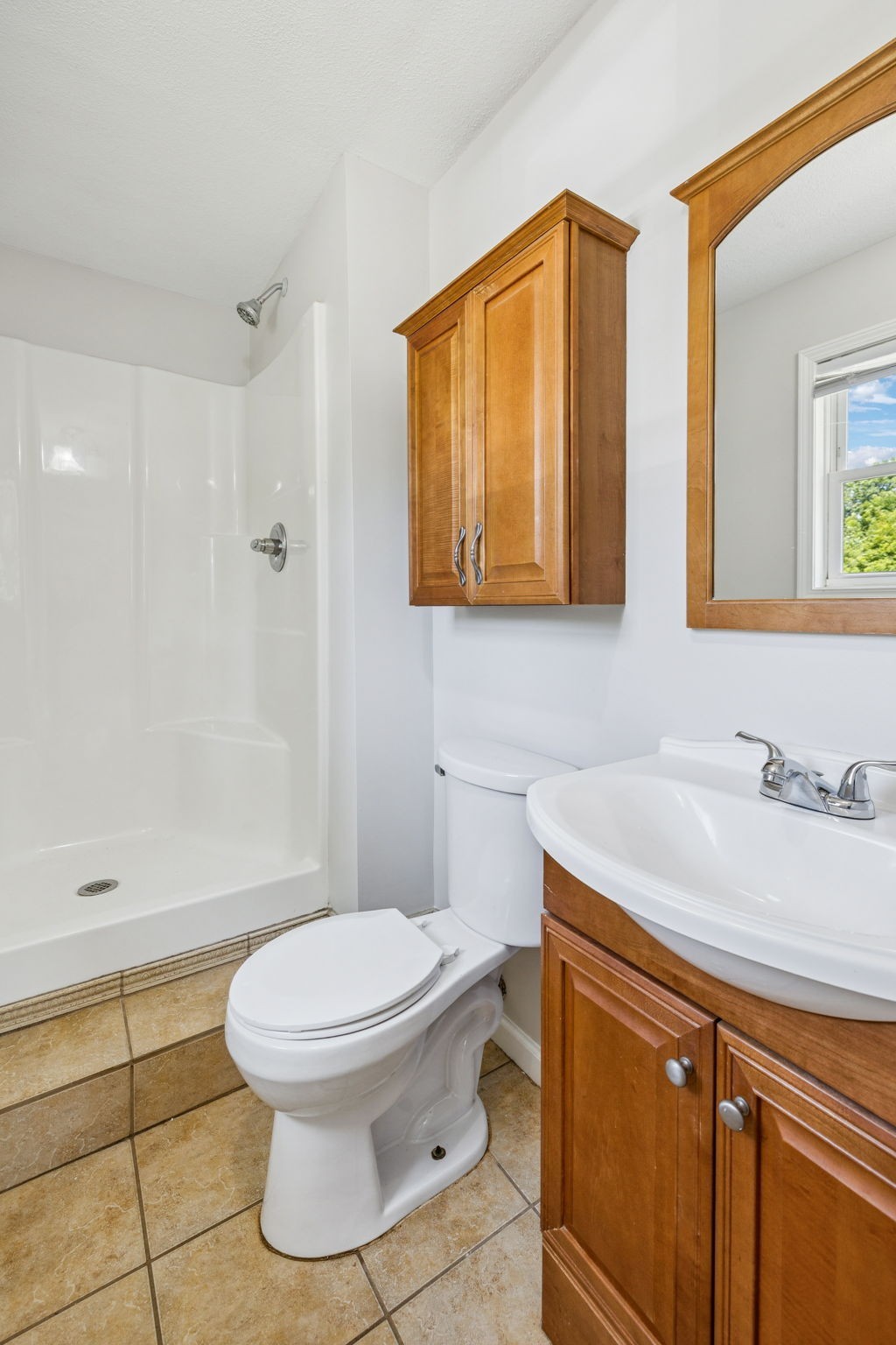 2585 Pow Road Baxter, TN 38544 - Photo 43 of 83 a bathroom with a sink a toilet and mirror