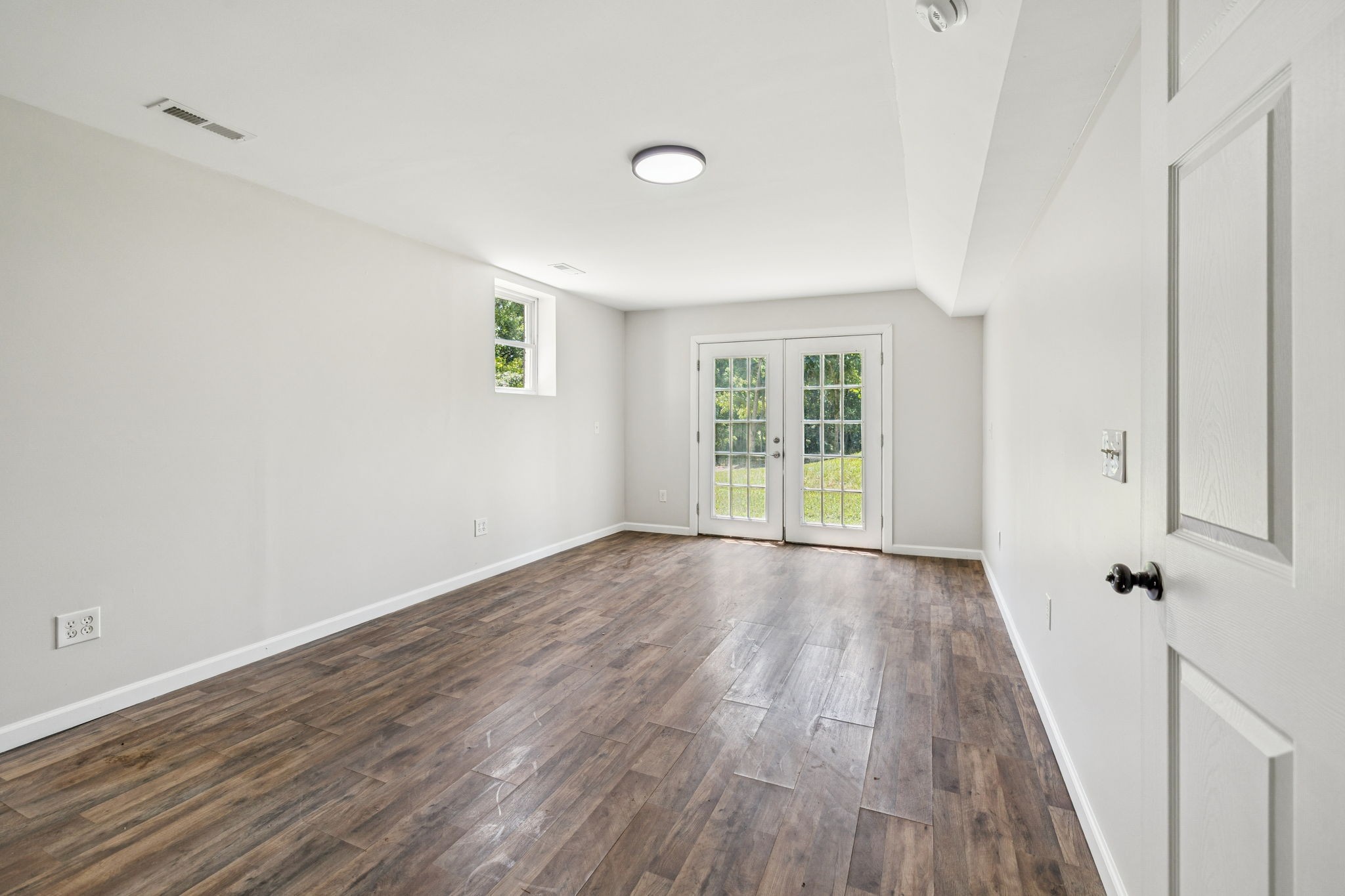 2585 Pow Road Baxter, TN 38544 - Photo 51 of 83 wooden floor in an empty room with a window