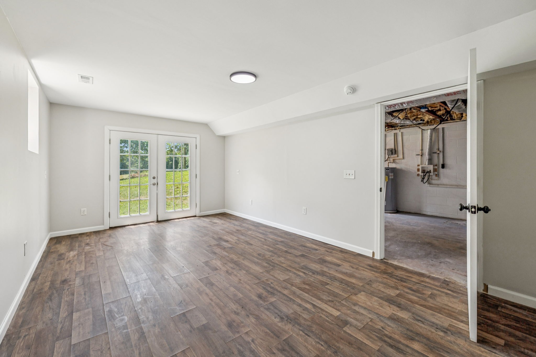 2585 Pow Road Baxter, TN 38544 - Photo 53 of 83 wooden floor in an empty room with a window