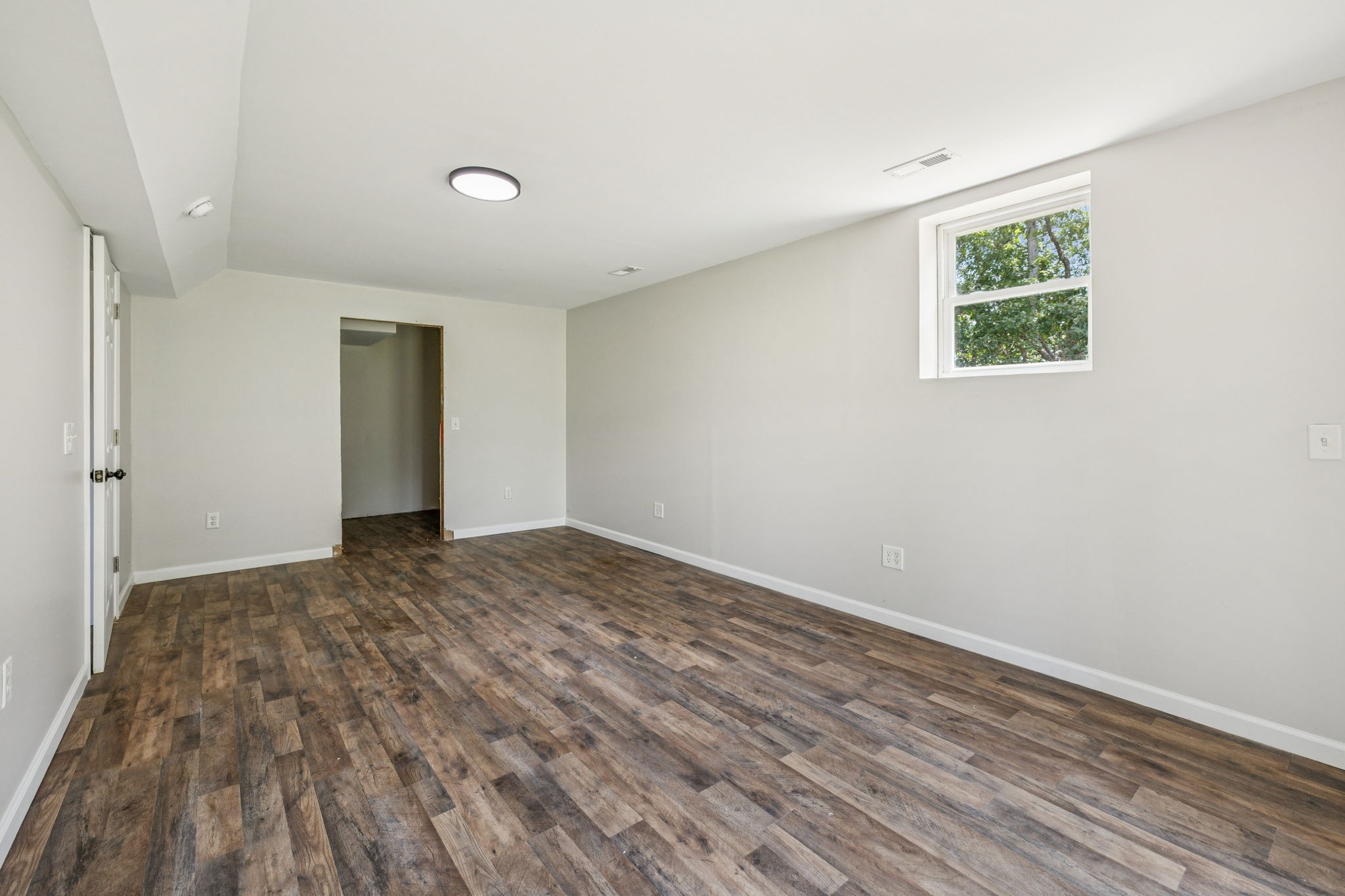 2585 Pow Road Baxter, TN 38544 - Photo 55 of 83 a view of an empty room with wooden floor and a window