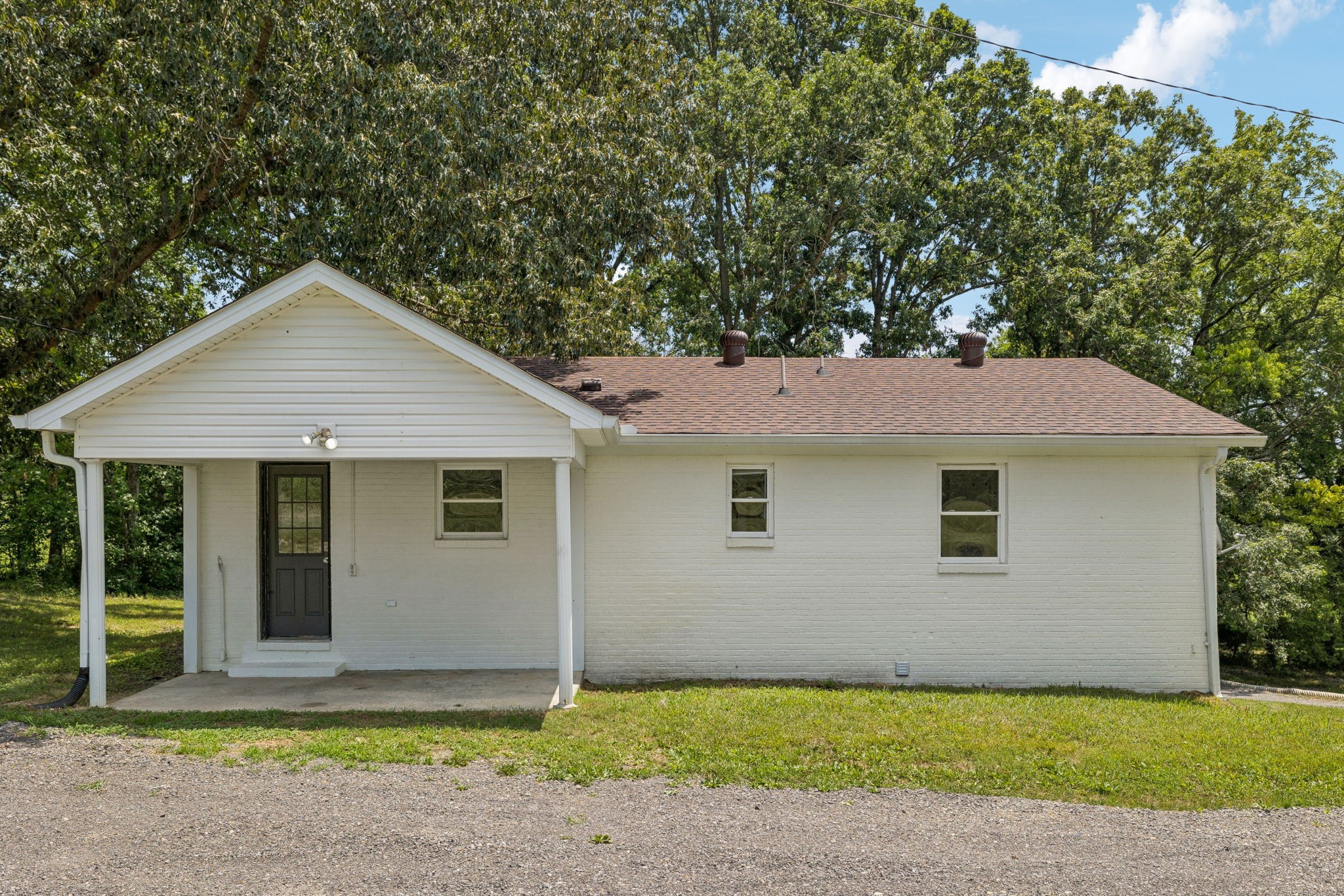 2585 Pow Road Baxter, TN 38544 - Photo 9 of 83 a front view of a house with a yard and garage