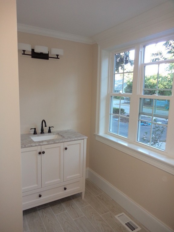 7 Abbott Road Natick, MA 01760 - Photo 22 of 30 a view of an empty room with a window