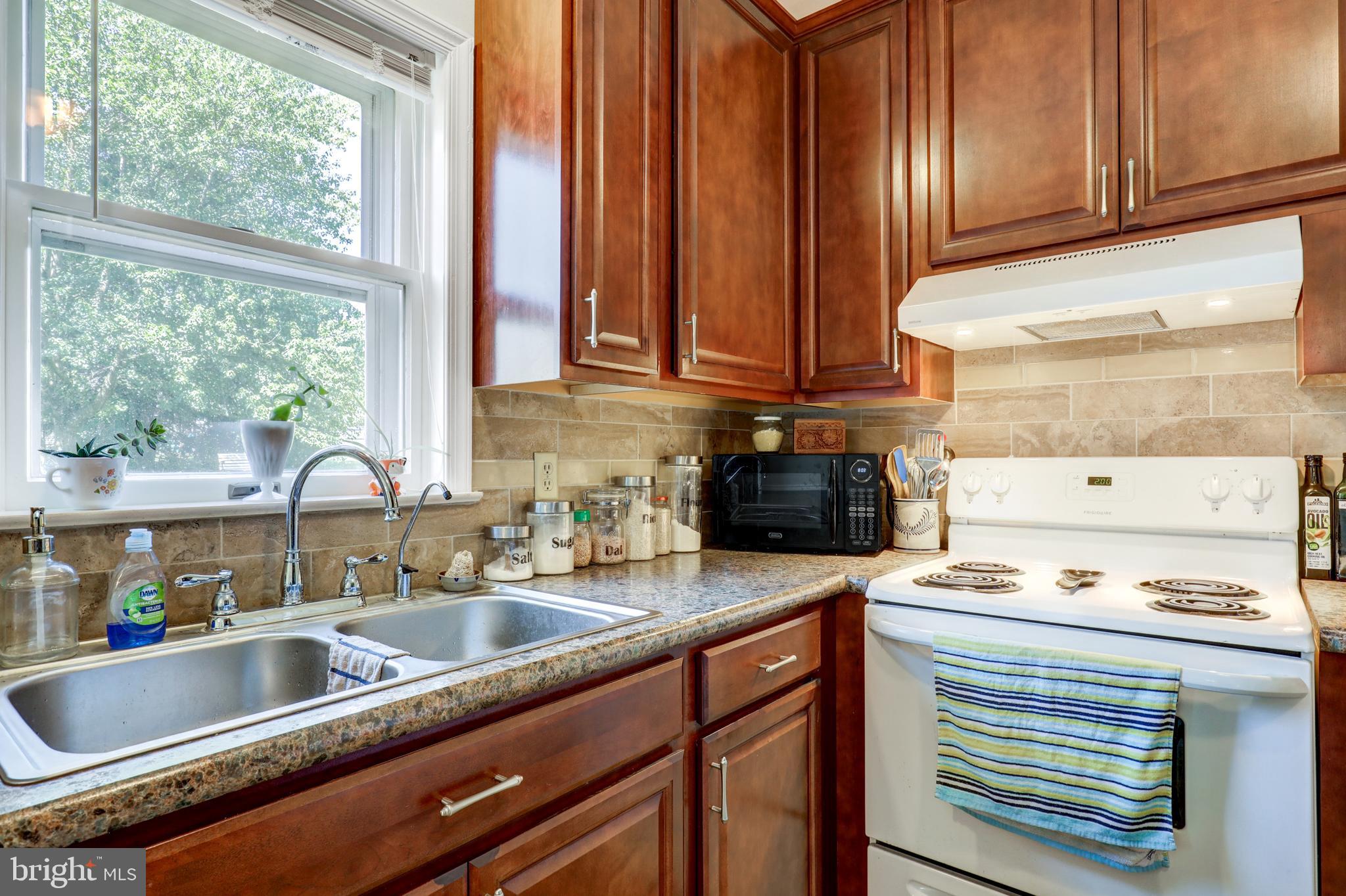 222 Miller Road Akron, PA 17501 - Photo 18 of 31 a kitchen with granite countertop a sink and a stove