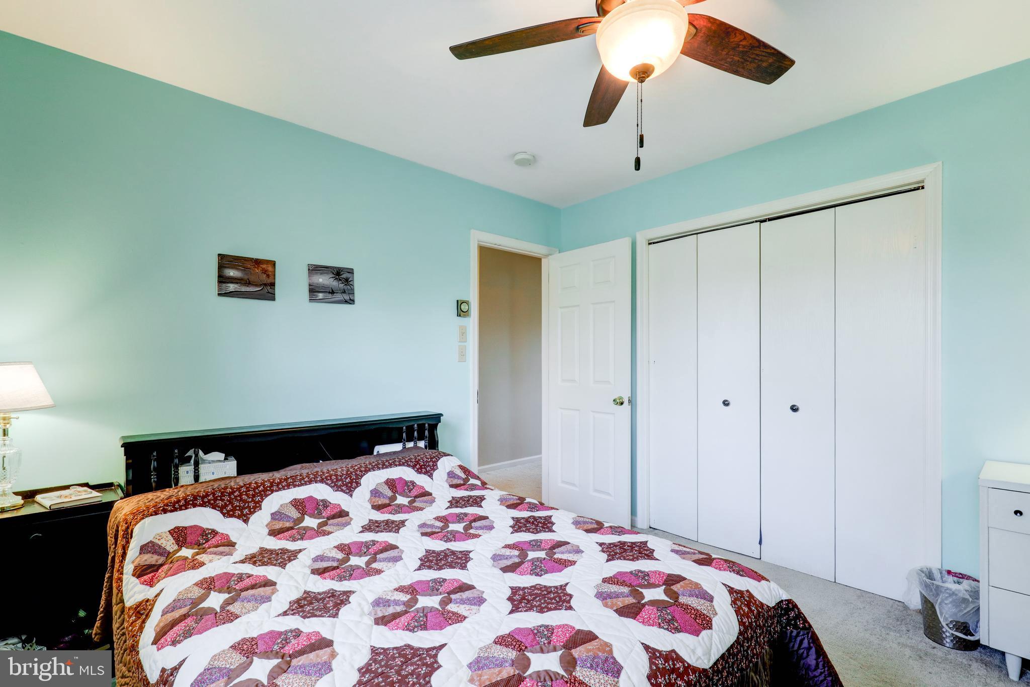 222 Miller Road Akron, PA 17501 - Photo 25 of 31 a bedroom with a bed and a chandelier