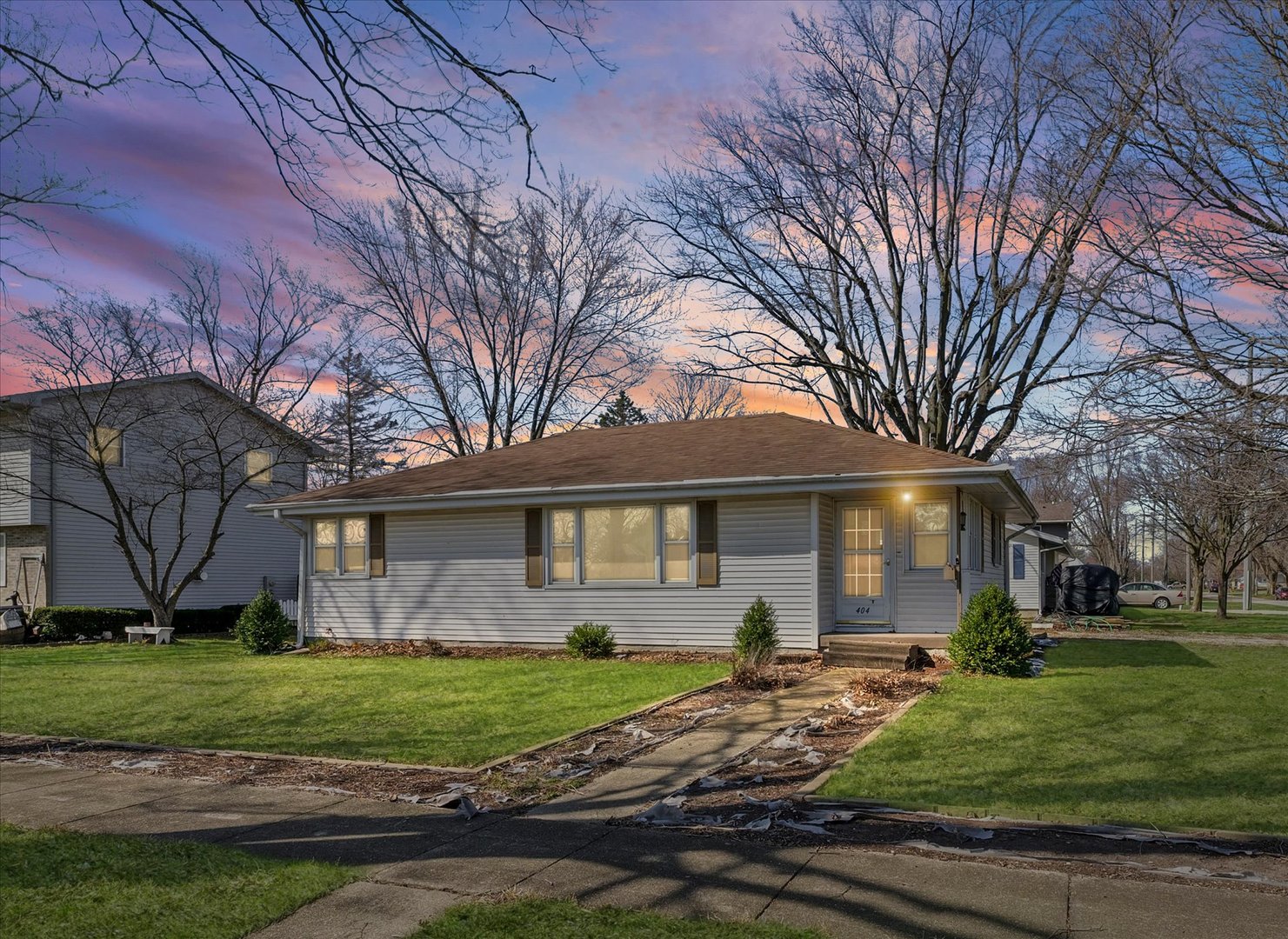 front view of a house with a yard