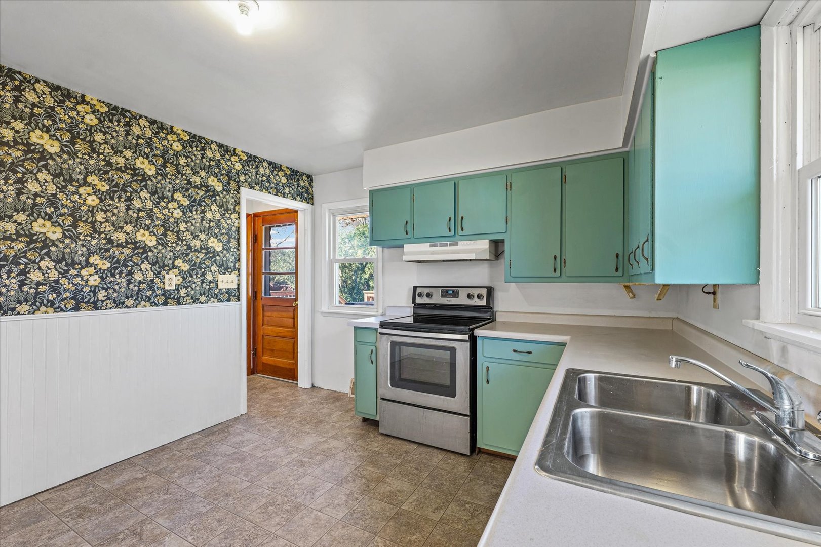 404 South Maple Street Gilman, IL 60938 - Photo 12 of 28 a kitchen with a sink and a stove top oven