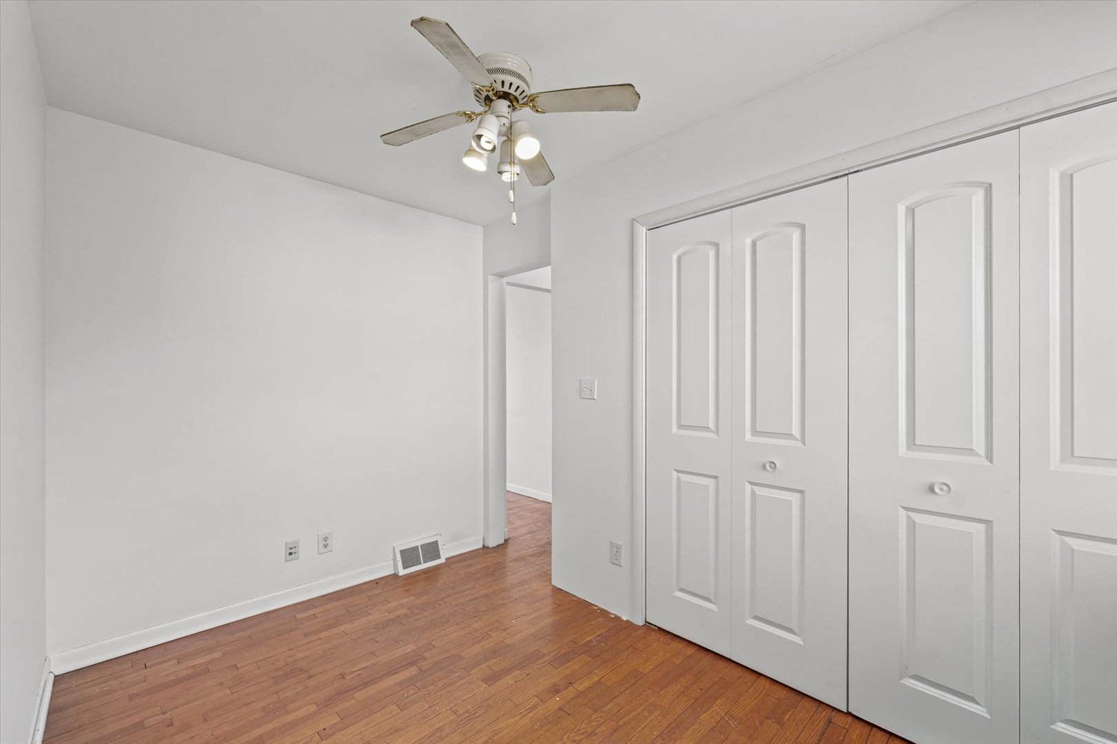 404 South Maple Street Gilman, IL 60938 - Photo 16 of 28 wooden floor in an empty room