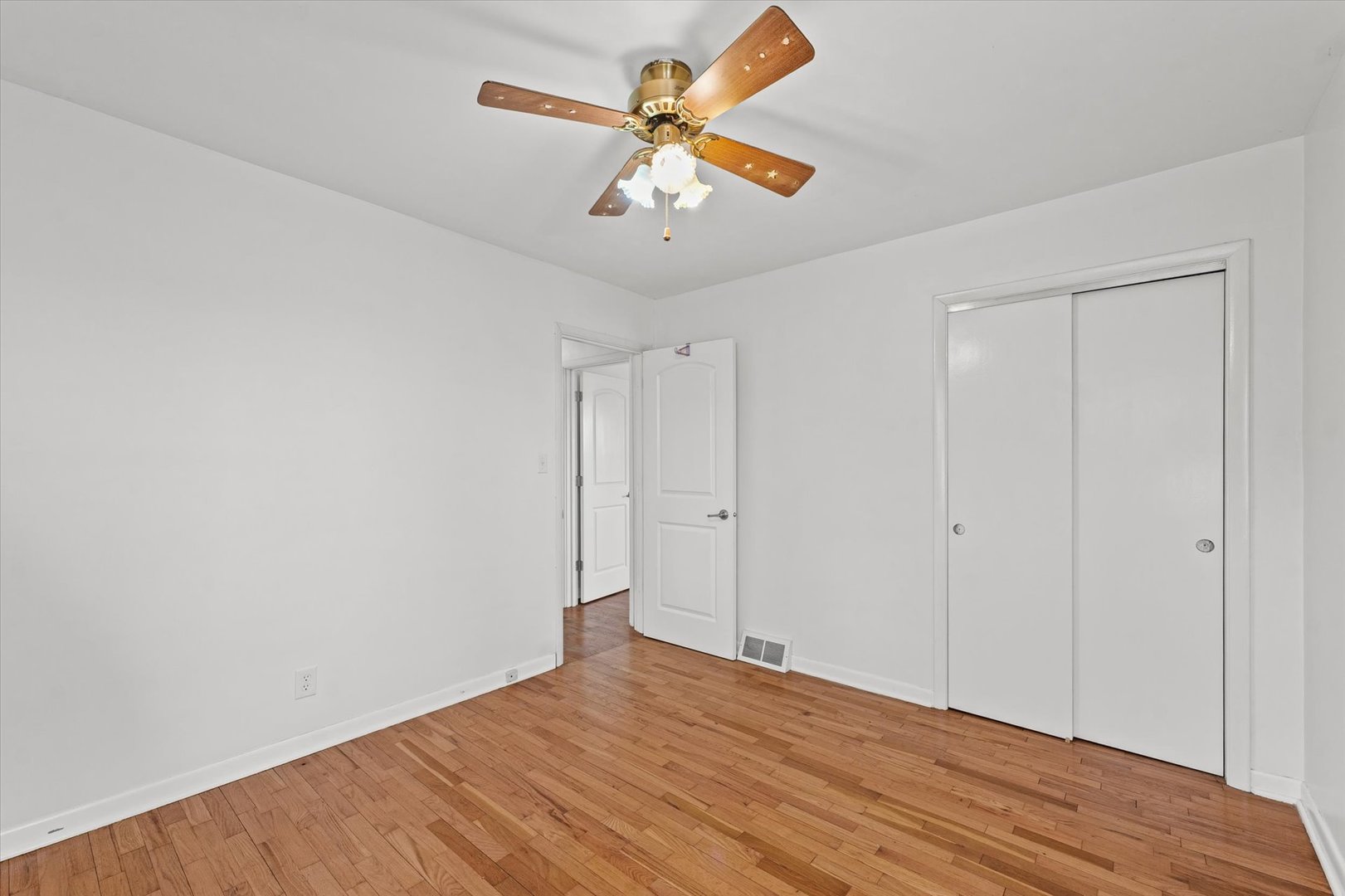 404 South Maple Street Gilman, IL 60938 - Photo 18 of 28 a view of empty room with wooden floor