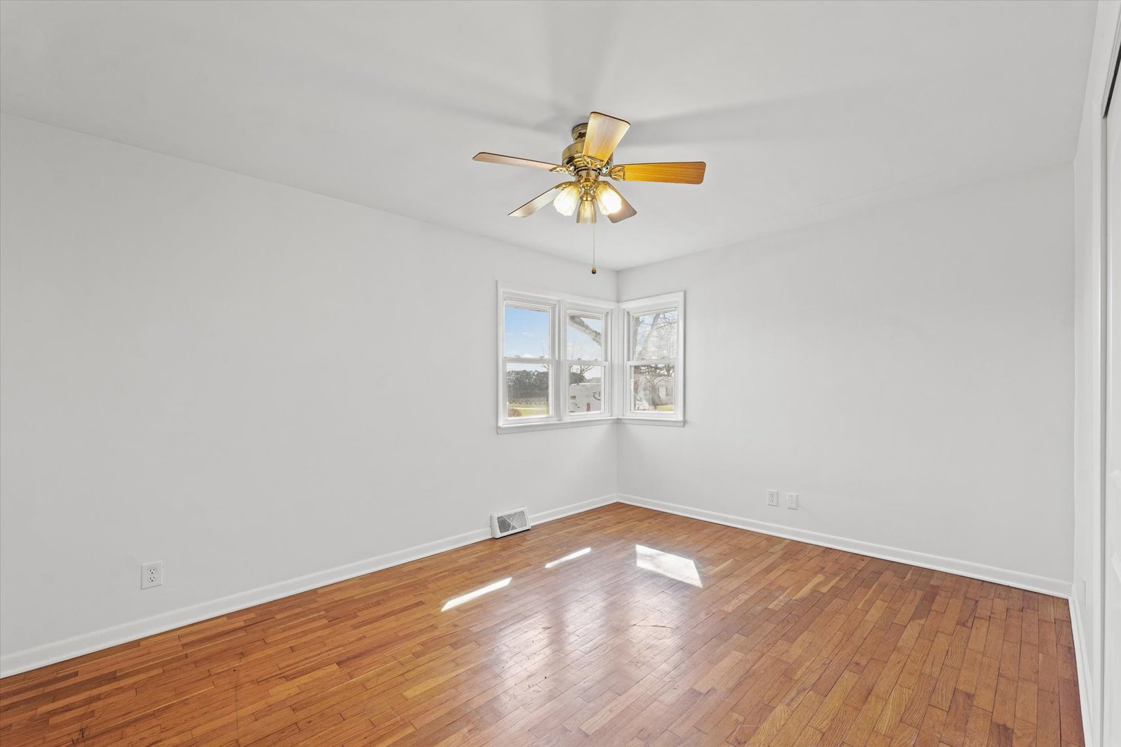 404 South Maple Street Gilman, IL 60938 - Photo 19 of 28 a view of empty room with wooden floor