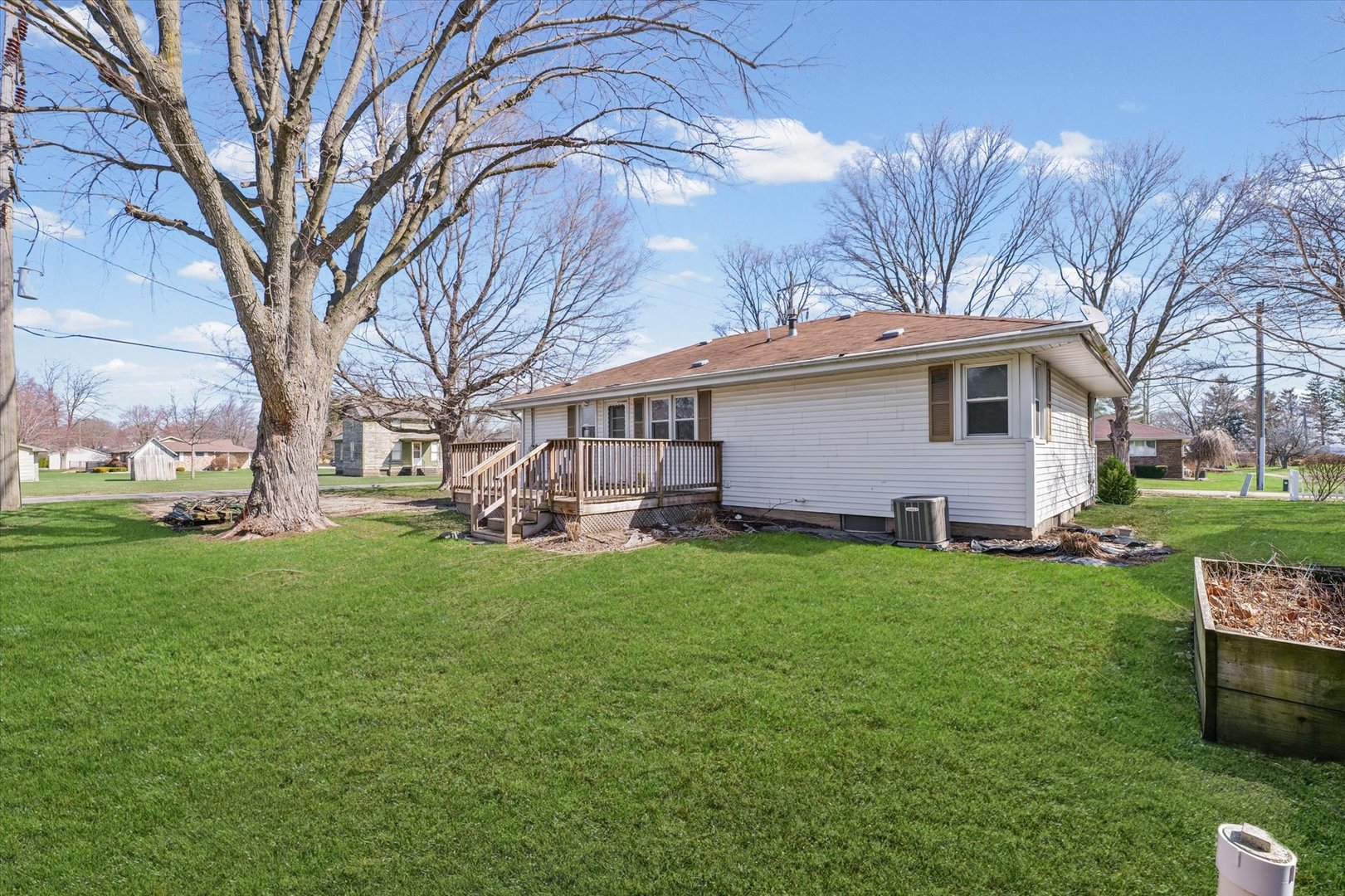 404 South Maple Street Gilman, IL 60938 - Photo 25 of 28 a view of a house with a backyard