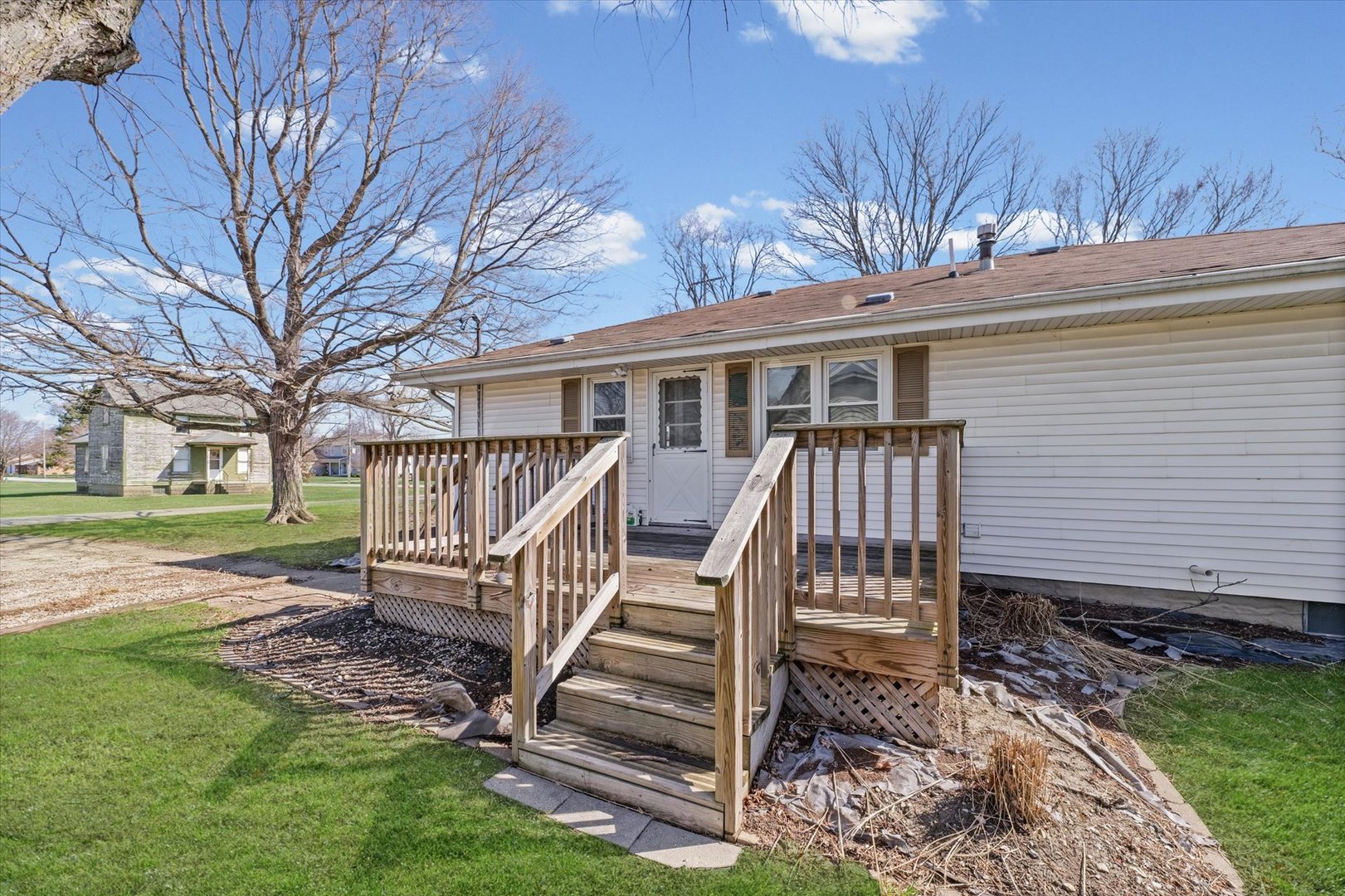 404 South Maple Street Gilman, IL 60938 - Photo 27 of 28 a view of a house with backyard and wooden fence