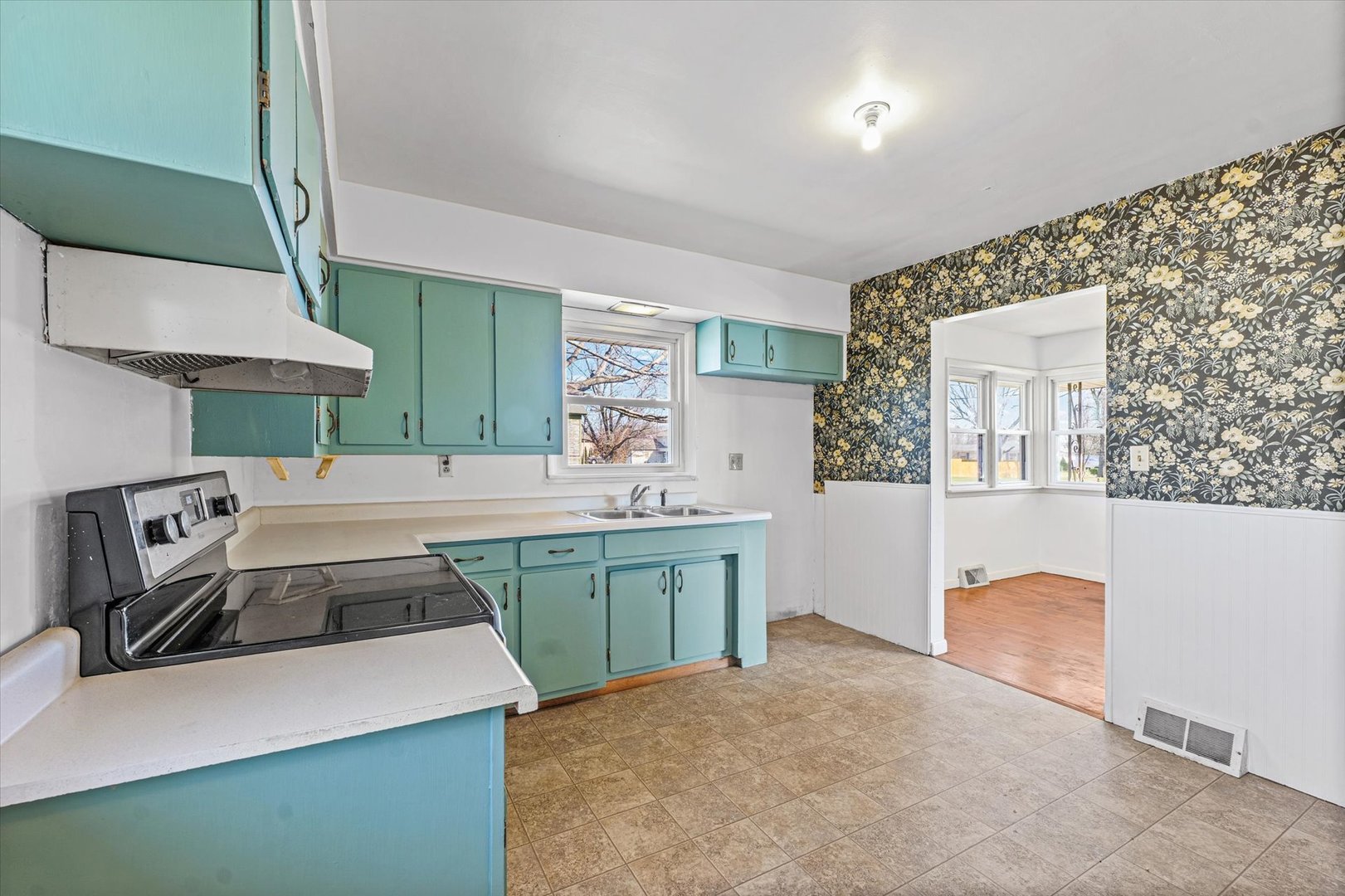 404 South Maple Street Gilman, IL 60938 - Photo 10 of 28 a kitchen that has a sink and a stove in it