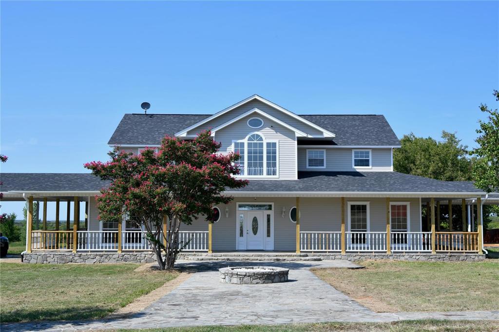 865 Higgins Road Sherman, TX 75092 - Photo 1 of 40 a front view of a house with a yard
