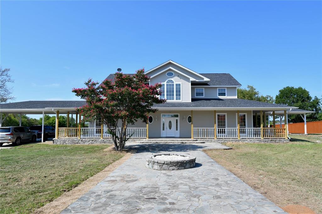 865 Higgins Road Sherman, TX 75092 - Photo 2 of 40 a front view of a house with a yard