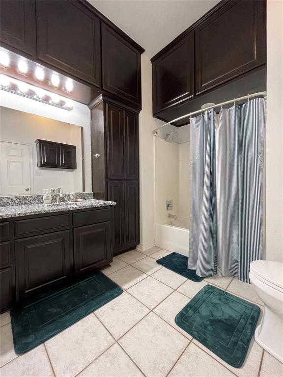 865 Higgins Road Sherman, TX 75092 - Photo 26 of 40 a bathroom with a sink a mirror and a shower