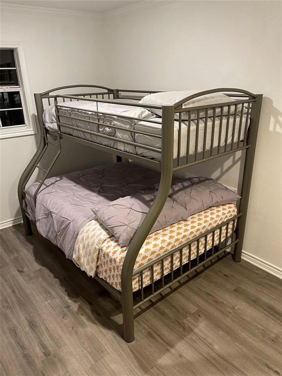 865 Higgins Road Sherman, TX 75092 - Photo 29 of 40 a bed sitting in a bedroom next to a window