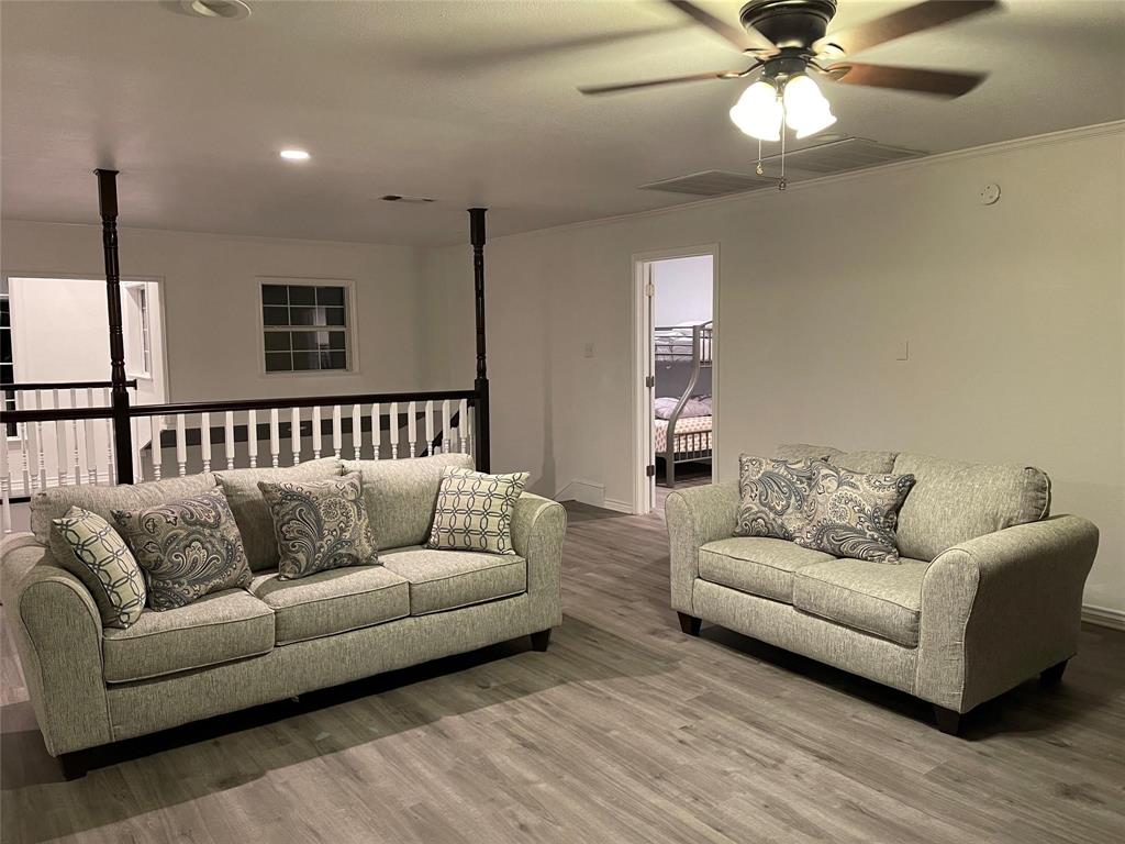 865 Higgins Road Sherman, TX 75092 - Photo 30 of 40 a living room with furniture and a couch