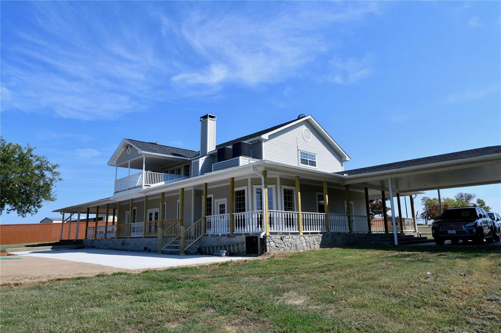 865 Higgins Road Sherman, TX 75092 - Photo 3 of 40 a view of house with a big yard and large trees