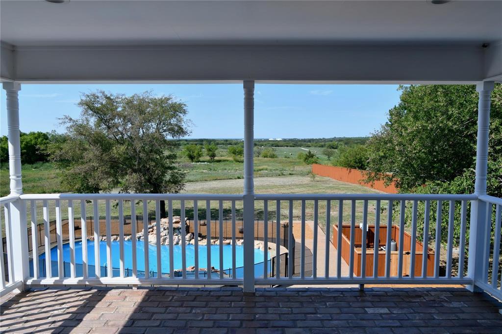 865 Higgins Road Sherman, TX 75092 - Photo 5 of 40 a view of a porch with a yard