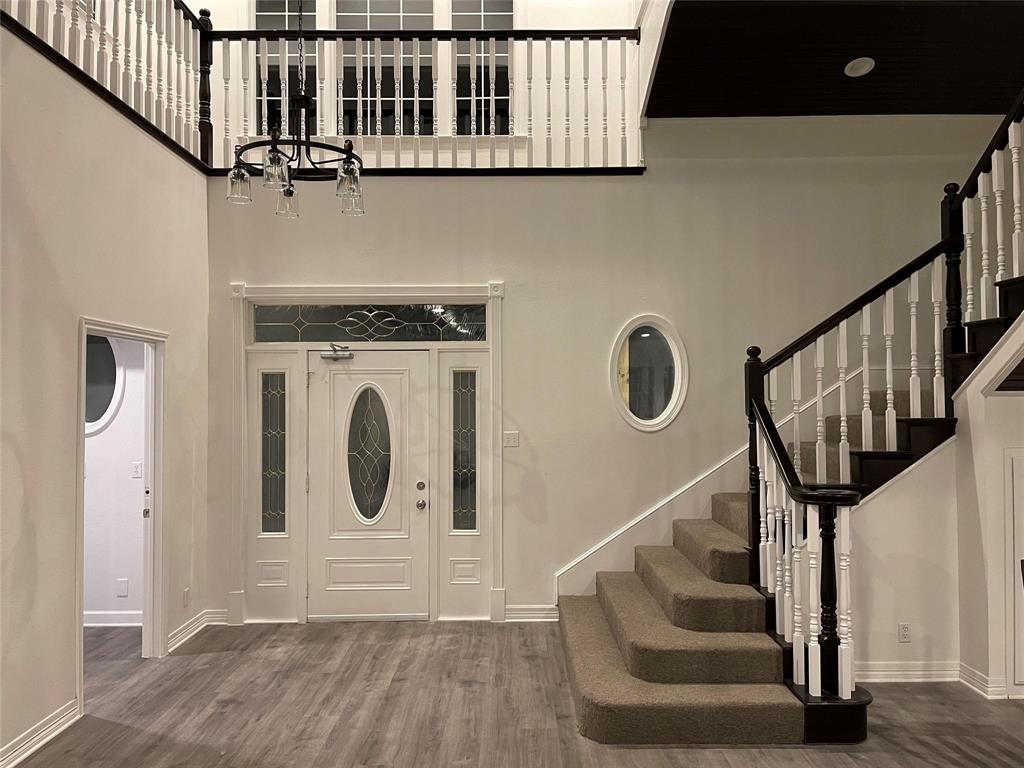 865 Higgins Road Sherman, TX 75092 - Photo 8 of 40 a front view of a house with entryway and wooden floor