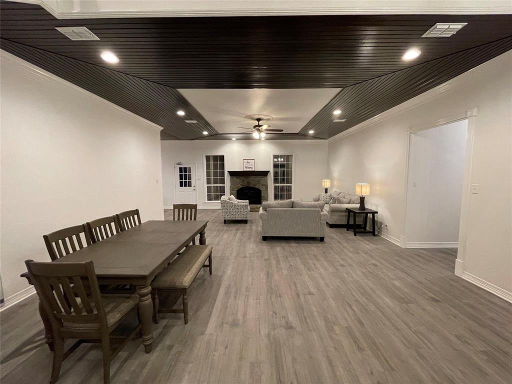 865 Higgins Road Sherman, TX 75092 - Photo 10 of 40 a living room with furniture and a chandelier