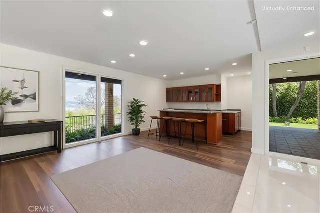 a large kitchen with stainless steel appliances a large window