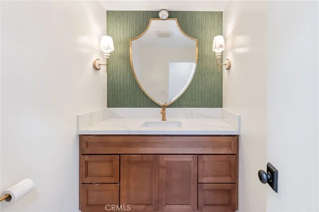 a bathroom with a sink and mirror