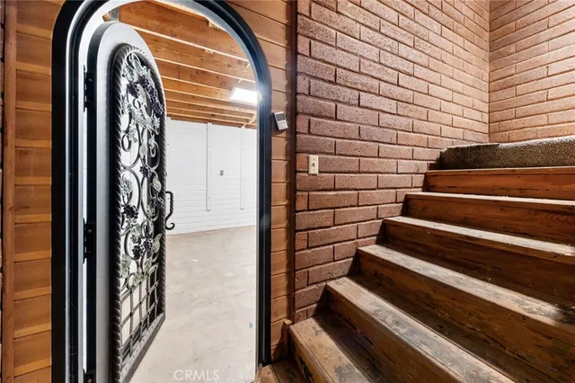 a view of staircase with white walls and windows