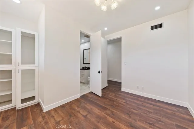 an empty room with wooden floor