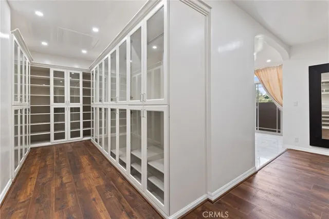 a view of wooden floor and windows in a room