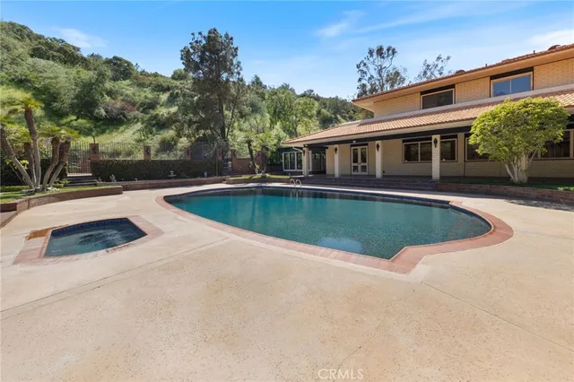 a view of a house with swimming pool