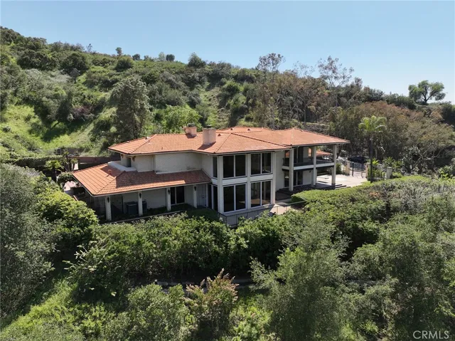 an aerial view of a house with a garden