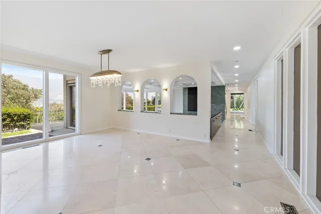 a view of a hallway with windows