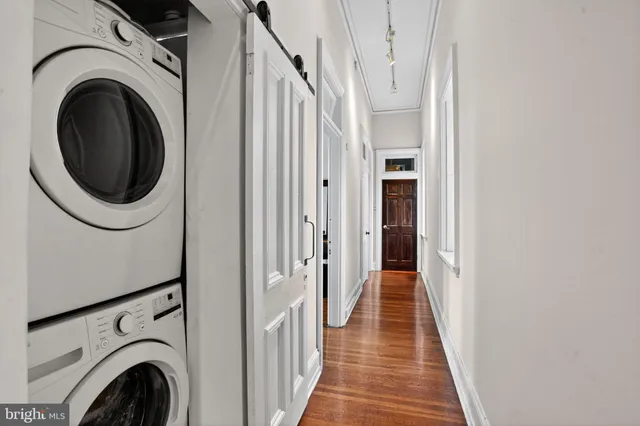 a view of a hallway with washer and dryer