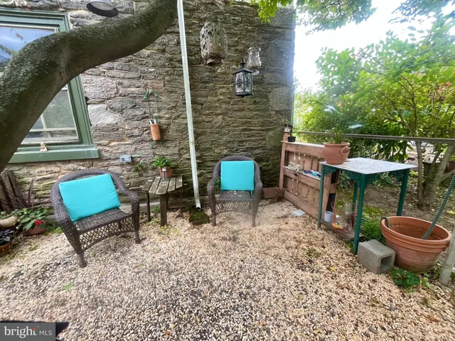 a backyard of a house with outdoor seating