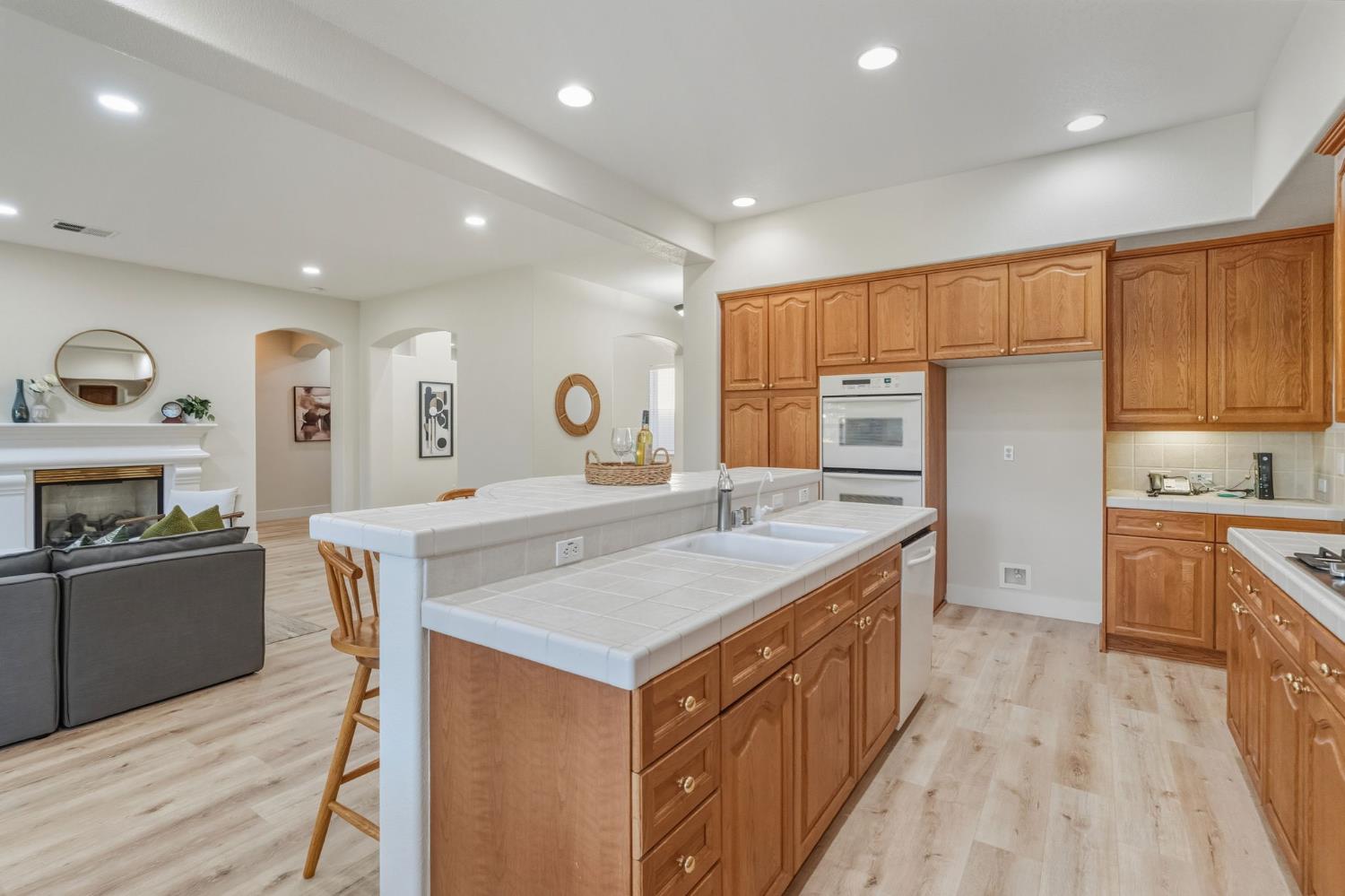 3412 Muscat Way Rancho Cordova, CA 95670 - Photo 13 of 33 a kitchen with cabinets and wooden floor