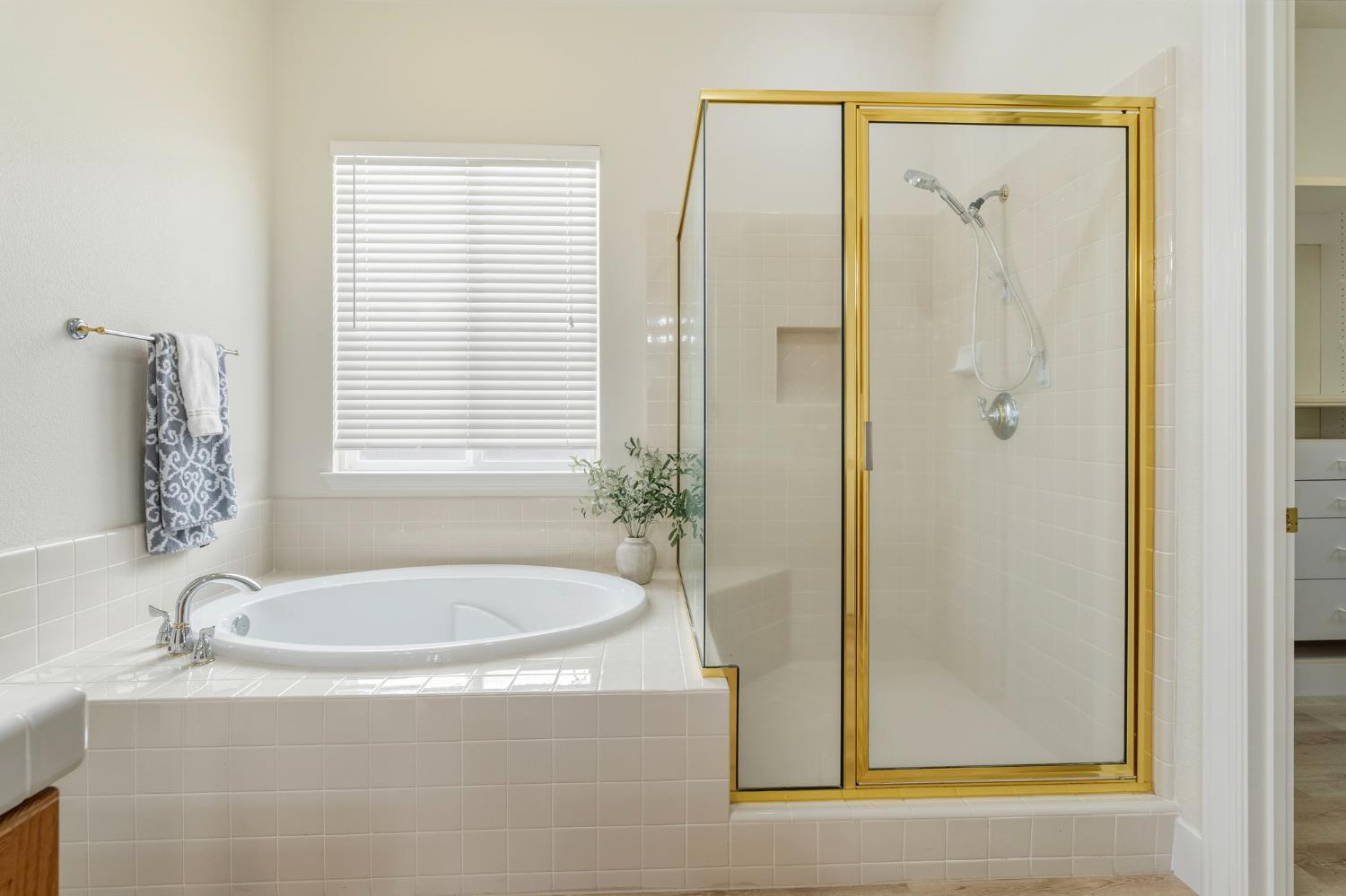 3412 Muscat Way Rancho Cordova, CA 95670 - Photo 22 of 33 a white bath tub sitting next to a bathroom