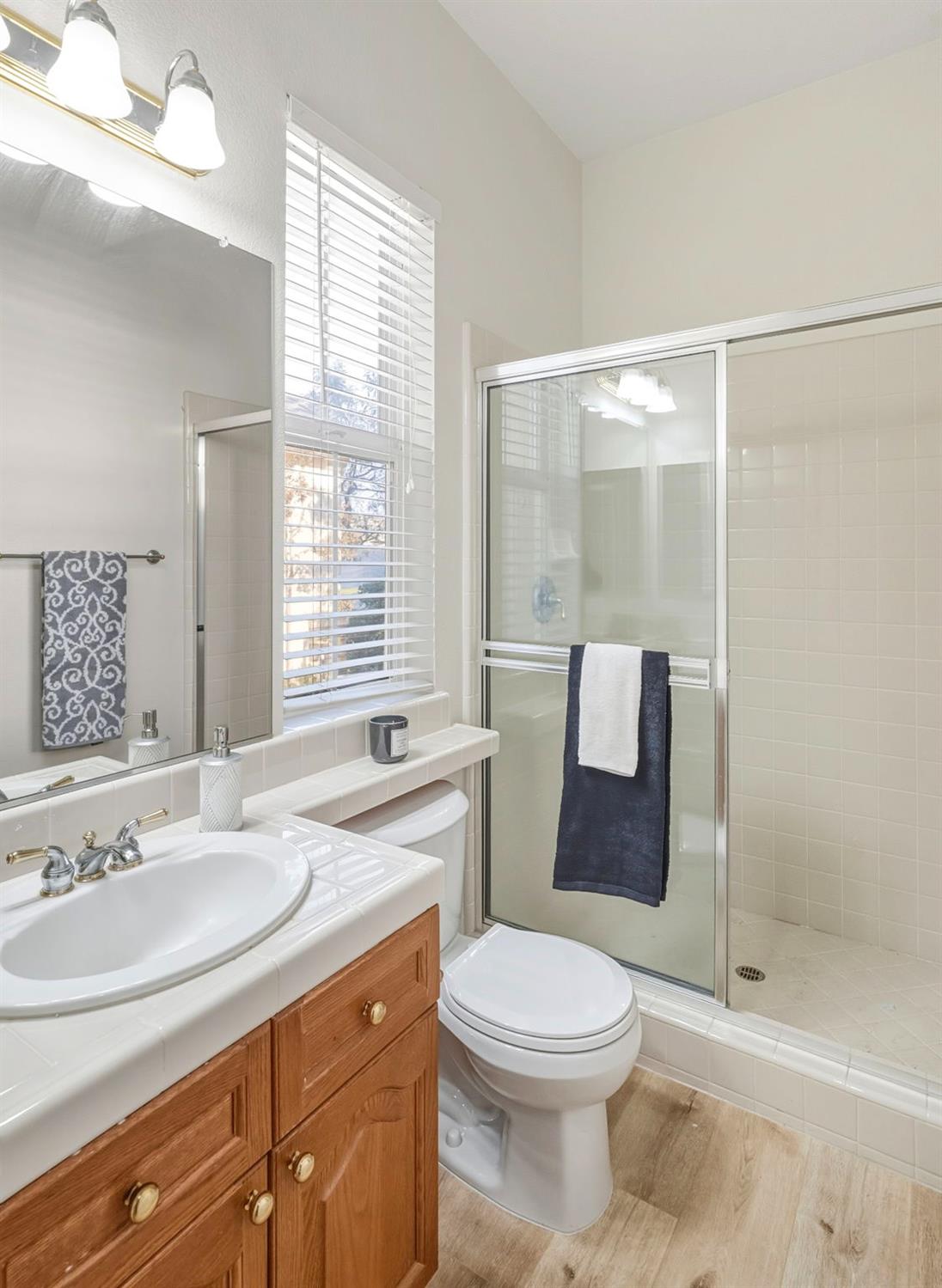 3412 Muscat Way Rancho Cordova, CA 95670 - Photo 28 of 33 a bathroom with a sink a toilet and shower