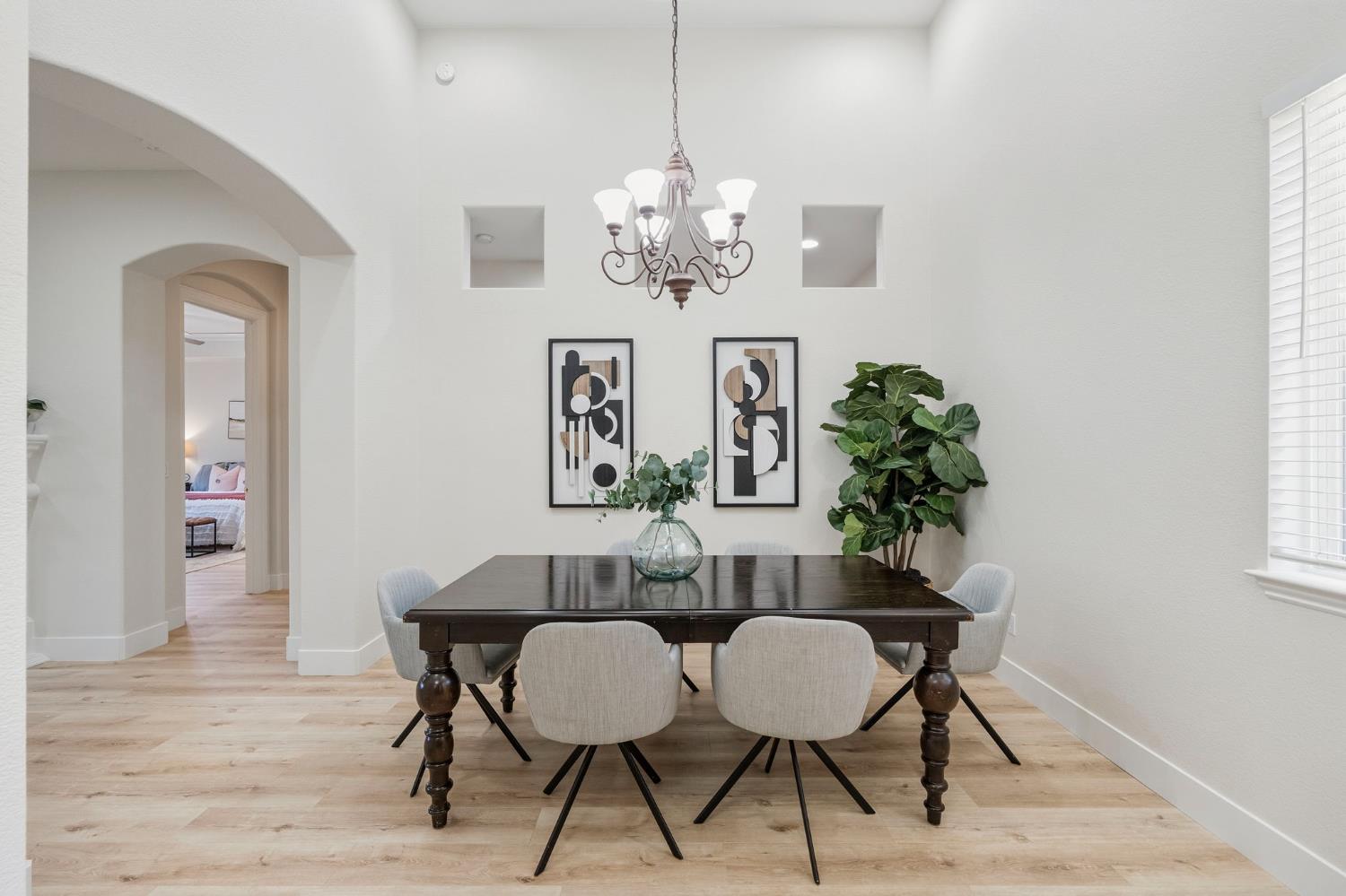 3412 Muscat Way Rancho Cordova, CA 95670 - Photo 10 of 33 a view of a dining room with furniture and chandelier