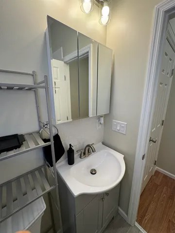 a bathroom with a sink and a mirror