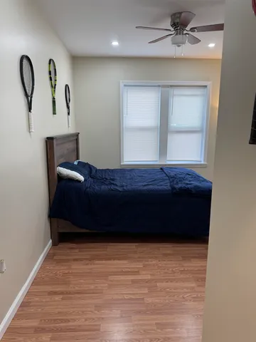 a bedroom with a bed and window