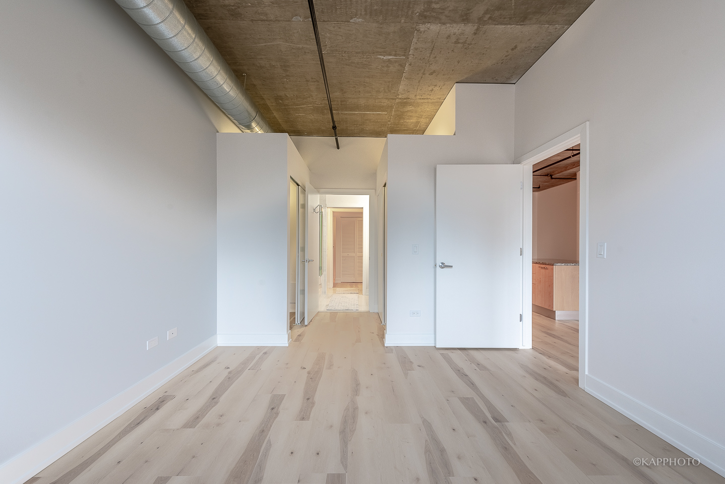 111 South Morgan Street, Unit 619 Chicago, IL 60607 - Photo 25 of 35 a view of empty room with wooden floor