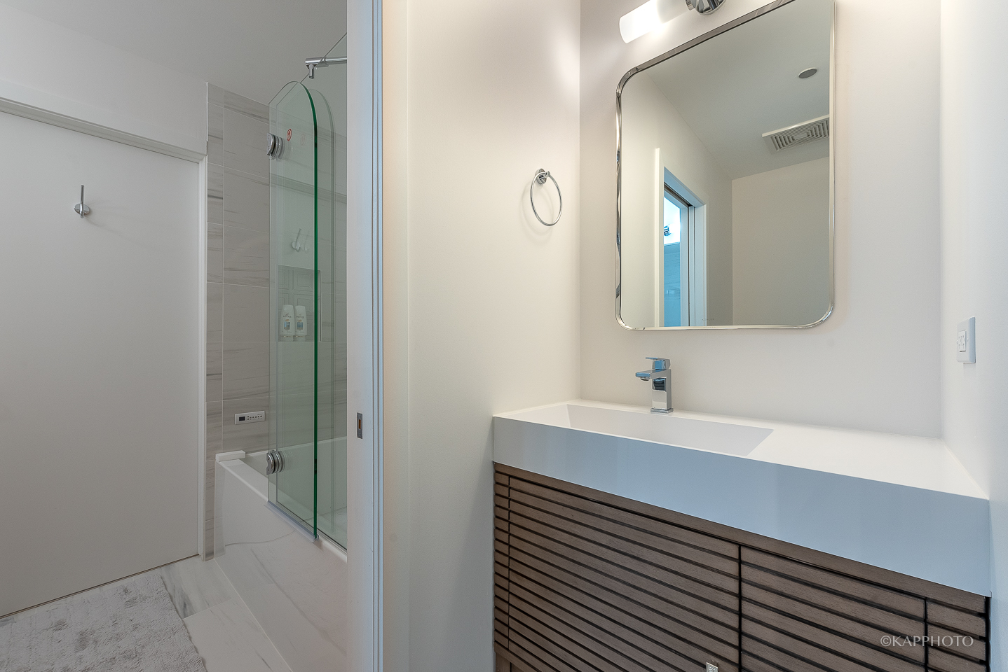 111 South Morgan Street, Unit 619 Chicago, IL 60607 - Photo 29 of 35 a bathroom with a sink and a mirror