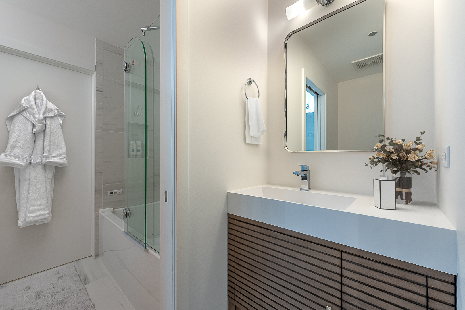 111 South Morgan Street, Unit 619 Chicago, IL 60607 - Photo 8 of 35 a bathroom with a sink a shower and a mirror