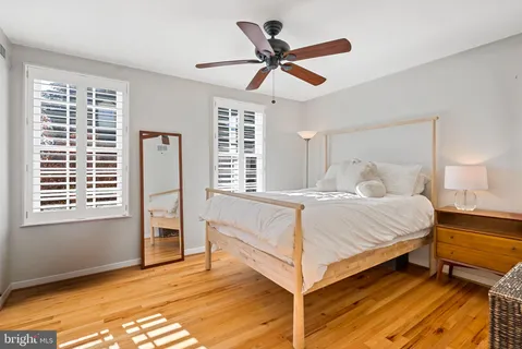 a bed room with a bed and a window