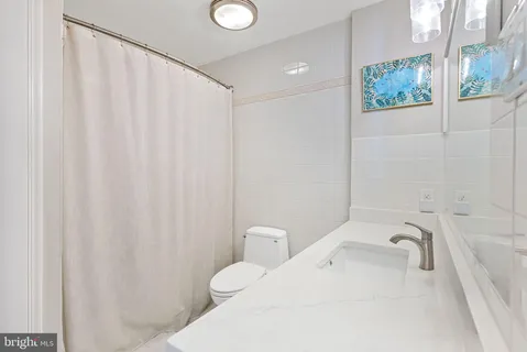 a bathroom with a toilet and sink