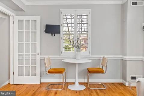 a view of kitchen island with furniture and lamp