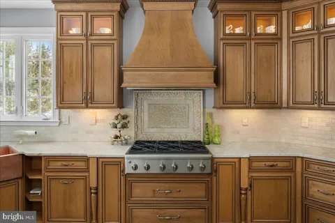 a kitchen with granite countertop cabinets stainless steel appliances and a sink