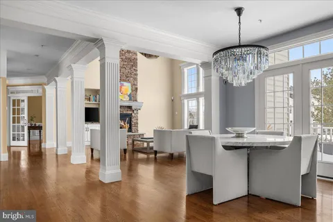 a view of a livingroom with furniture window and wooden floor