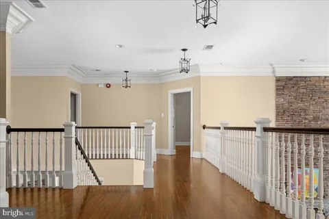 a view of a balcony with wooden floor
